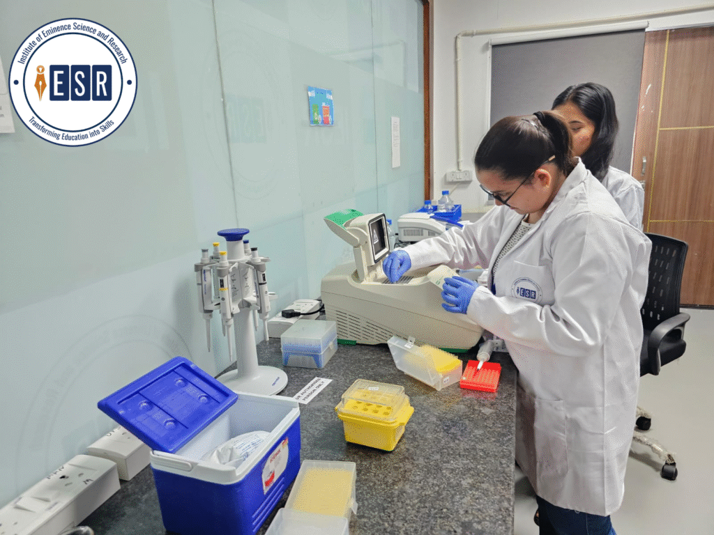 Students conducting molecular biology experiments with lab equipment at IESR Institute.