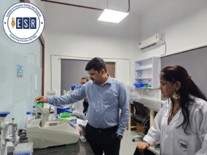 Instructor guiding students during molecular biology training at IESR laboratory