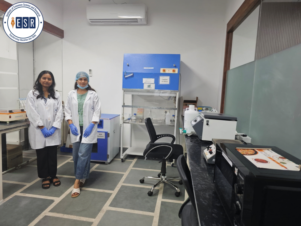Students in a nanotechnology laboratory at IESR wearing lab coats and gloves during practical training.